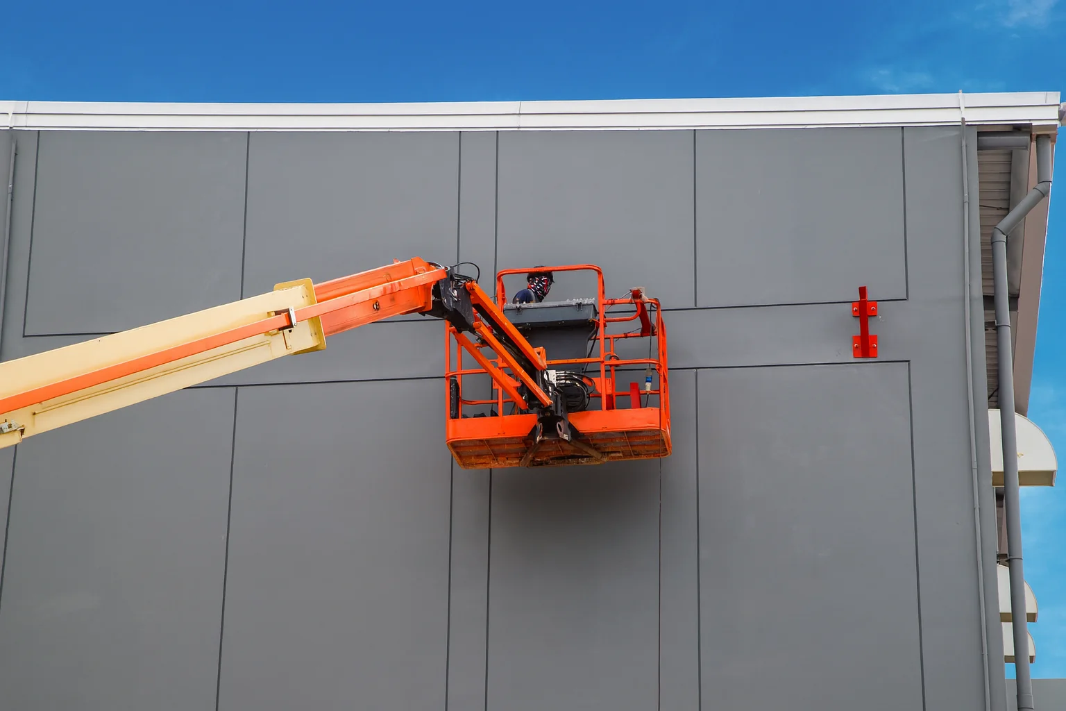 Professional commercial painting contractors working on office building exterior in Miami